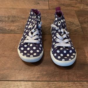 Navy and white polka dot high tops girl shoes.